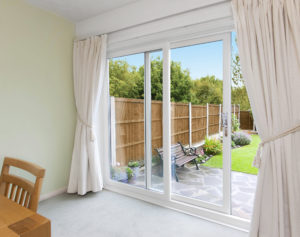 Patio doors with white curtains