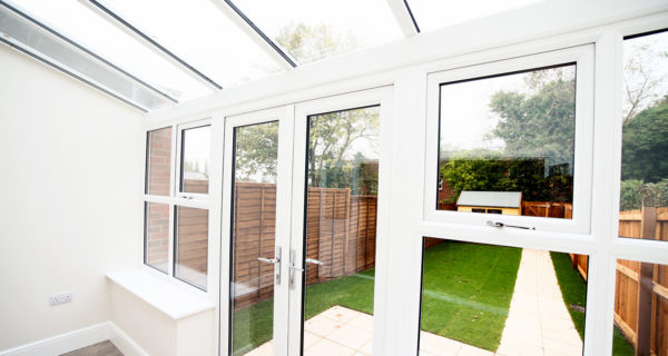 Looking outside a traditional lean to conservatory by KLG Rutland