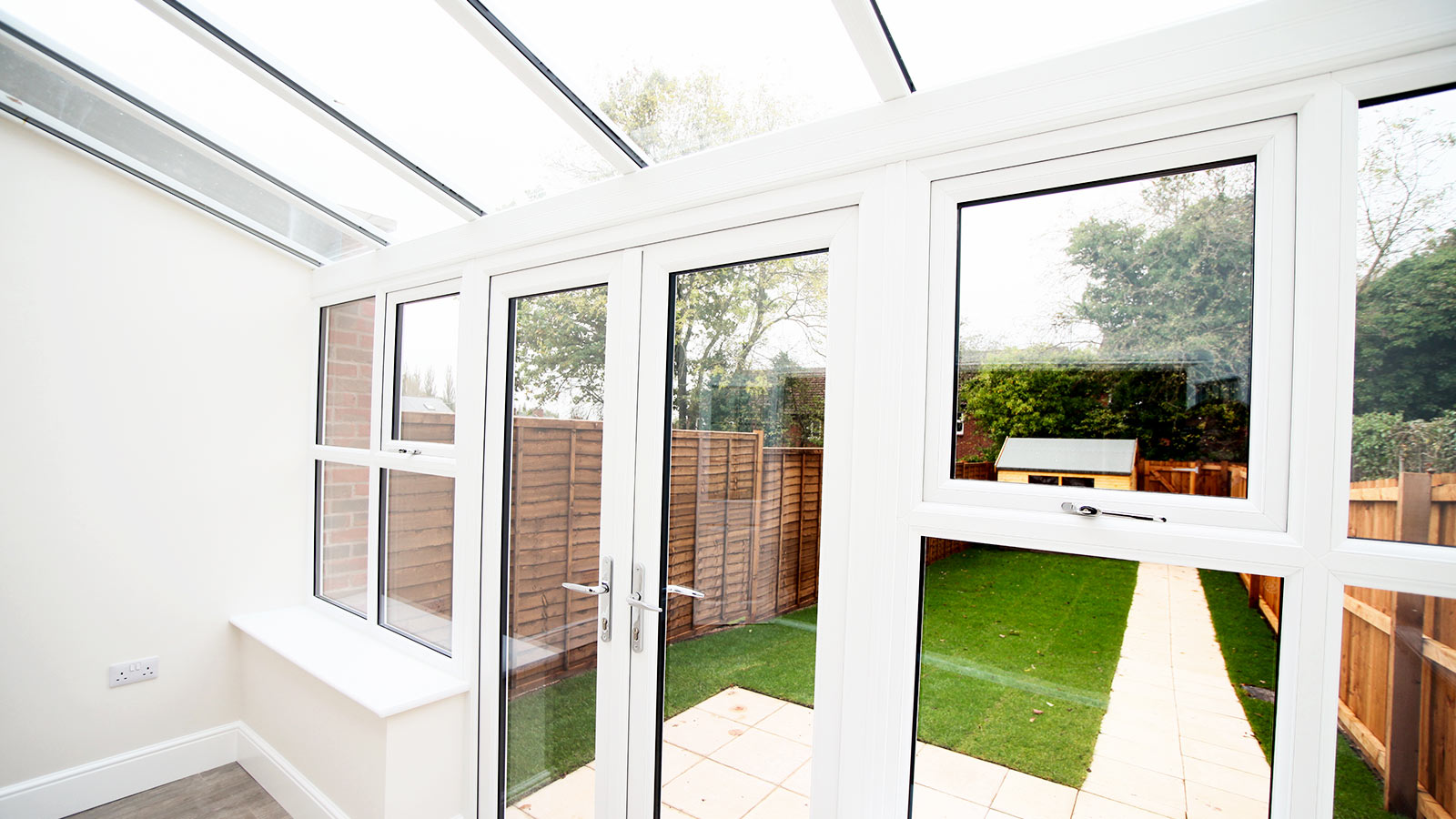 Looking outside a traditional lean to conservatory by KLG Rutland
