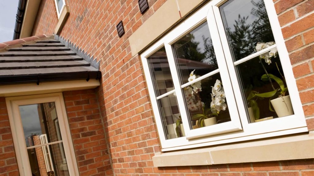 triple glazed windows on the side of a house