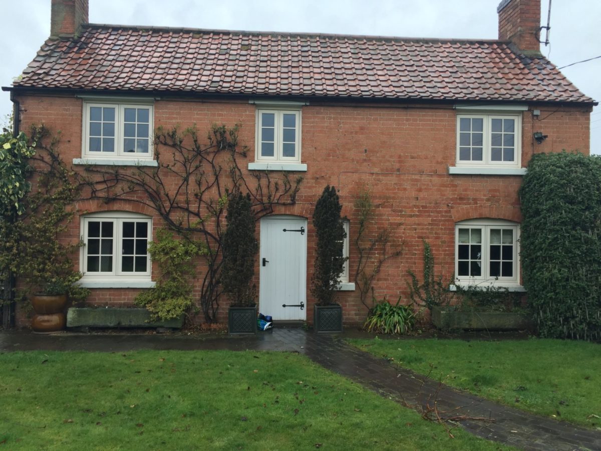 Wide shot of period house with flush sash windows
