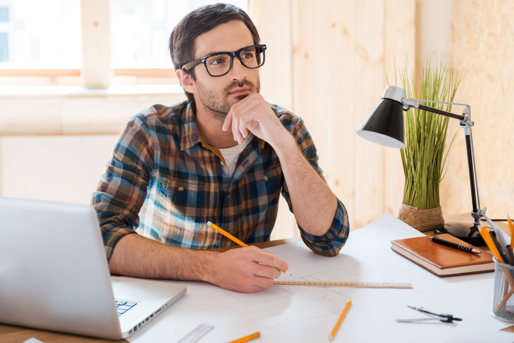 man planning with windows in the background