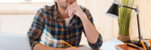 man planning with windows in the background