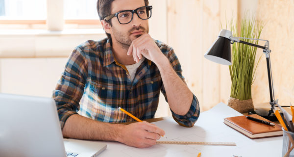 man planning with windows in the background