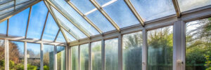 Conservatory windows with condensation droplets obscuring the view