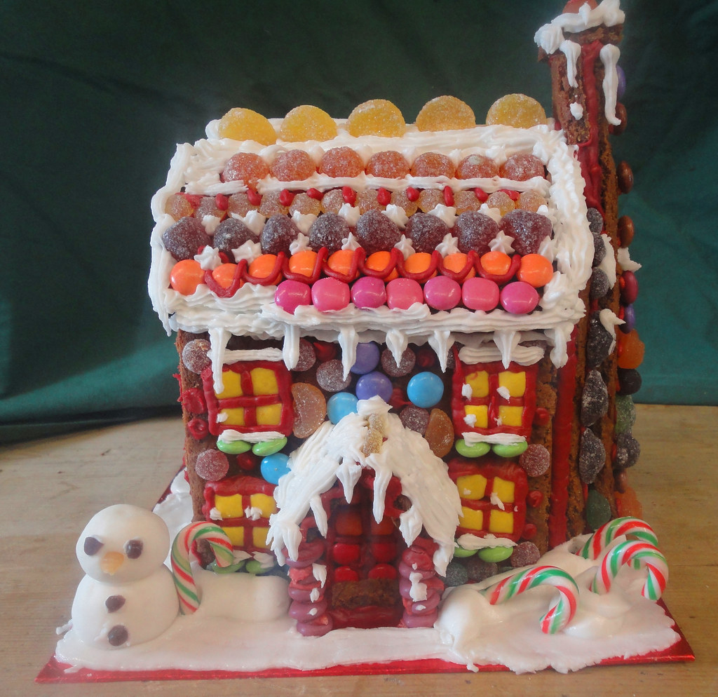 Gingerbread house covered in sweers, with excellent Smartie windows.