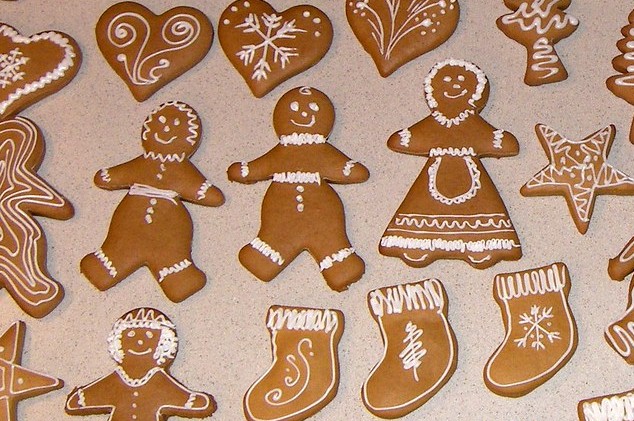 Family of gingerbread people wearing different clothes, alongside other shapes.