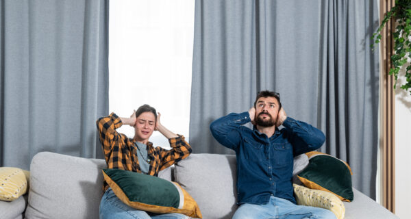 A couple struggling with outside noise at home. They need tips on soundproofing their home.