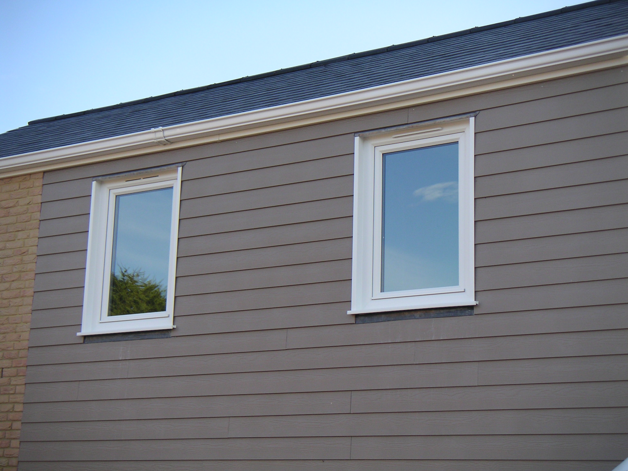 White tilt and turn windows from the exterior