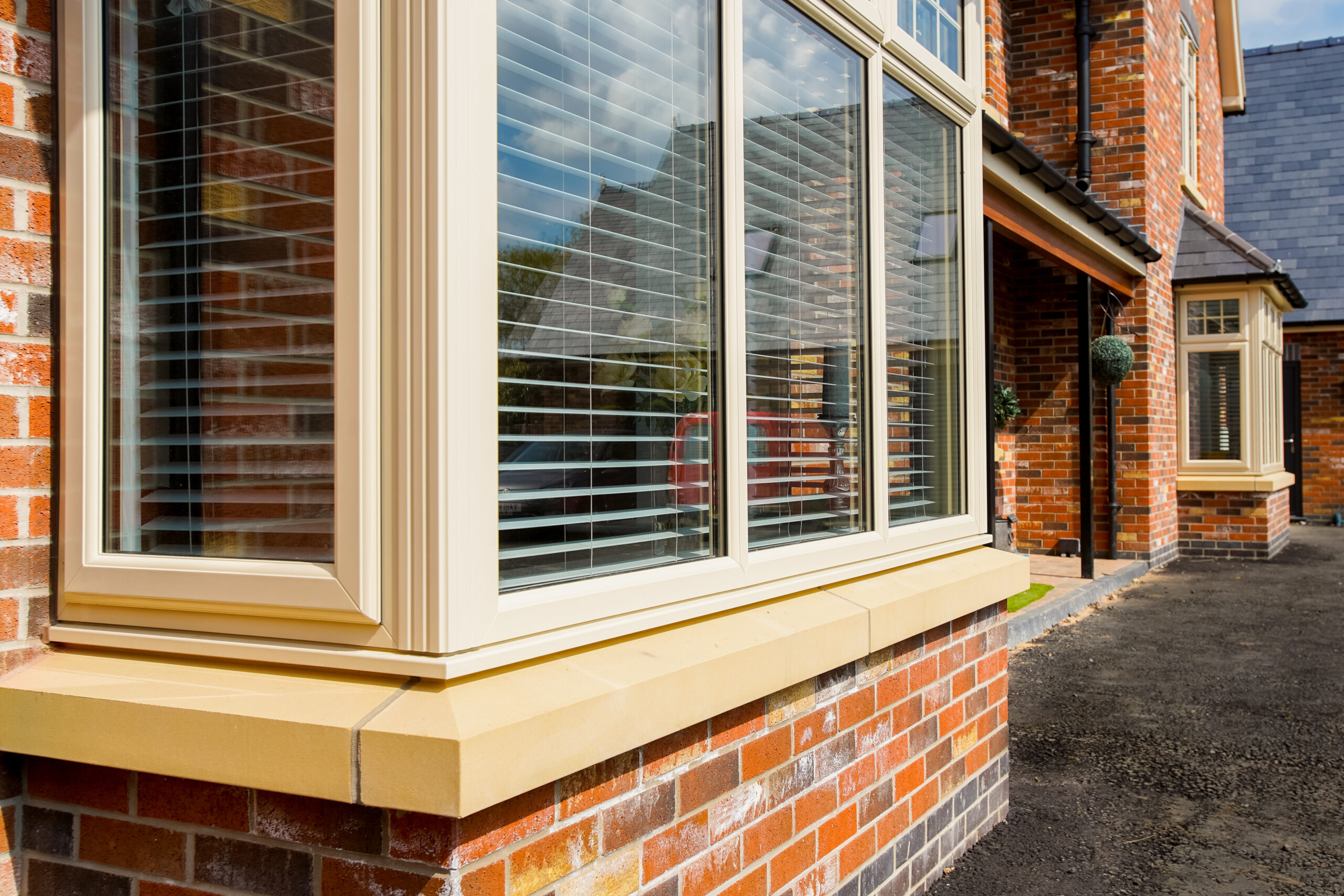Cream bay windows from the outside