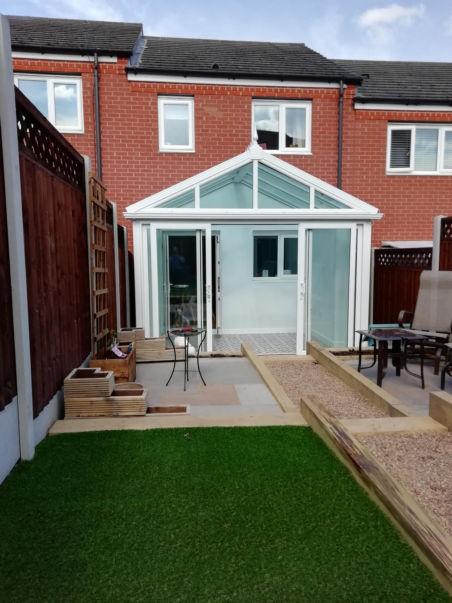 Conservatory with sliding patio doors on new build house