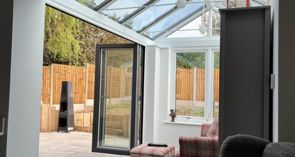 An interior view of bi fold doors in a conservatory