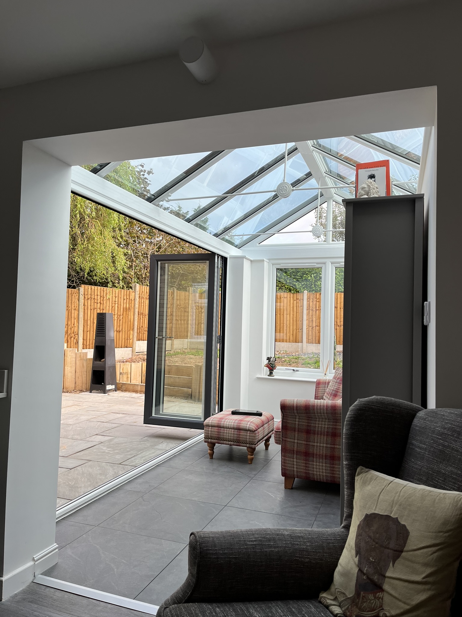 An interior view of bi fold doors in a conservatory